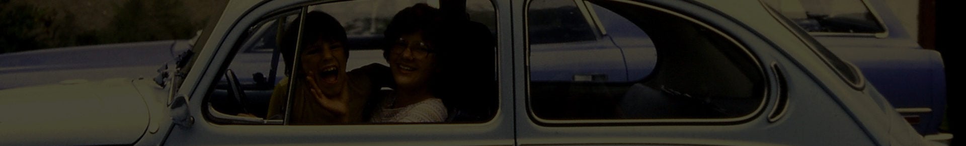Banner image of woman and kid in a car