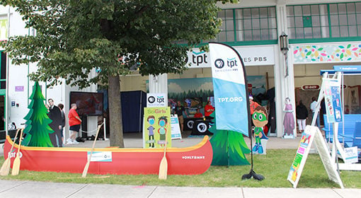 Photo of TPT Canoe and signs at the TPT booth at the Minnesota State Fair