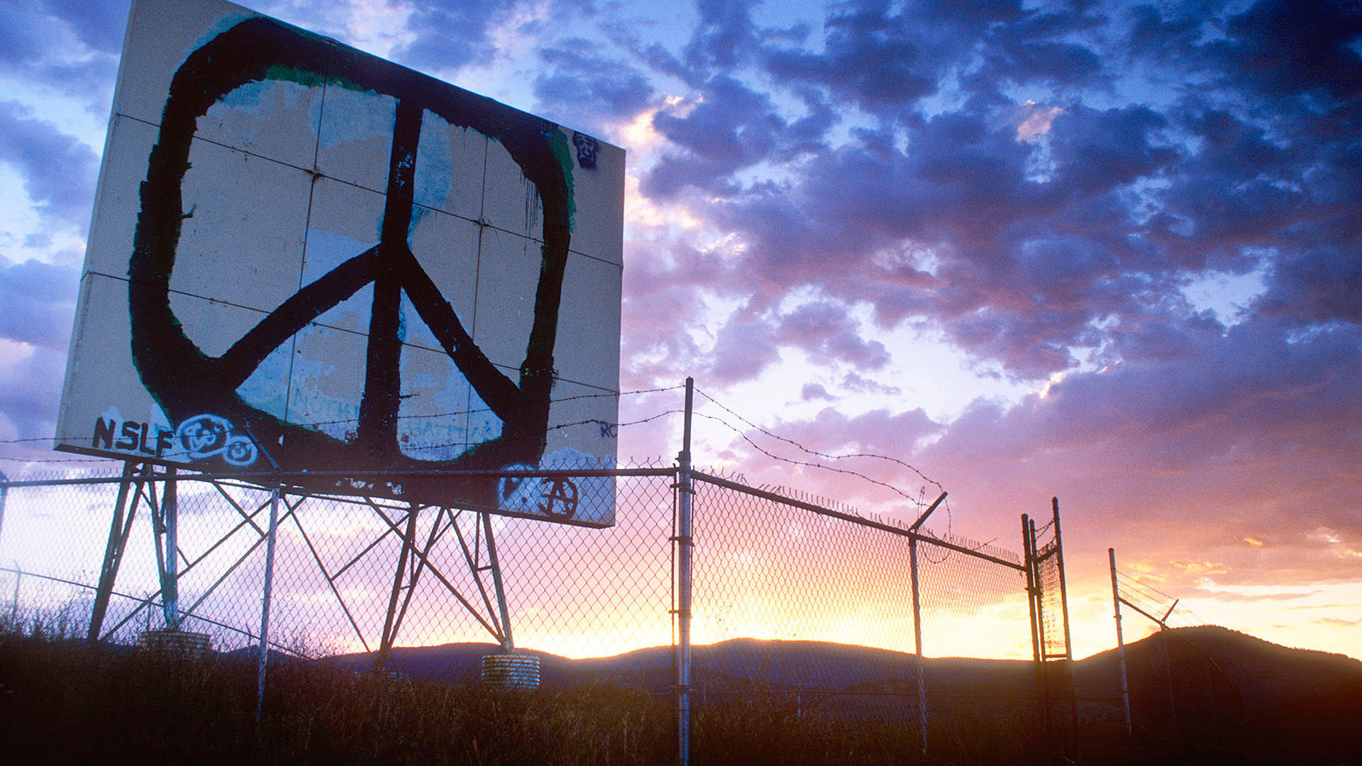 Photo of a billboard with a peace sign