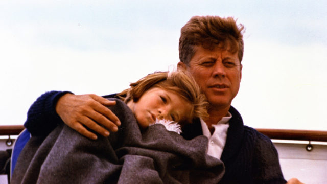 John F. Kennedy with his arm around a young Caroline Kennedy