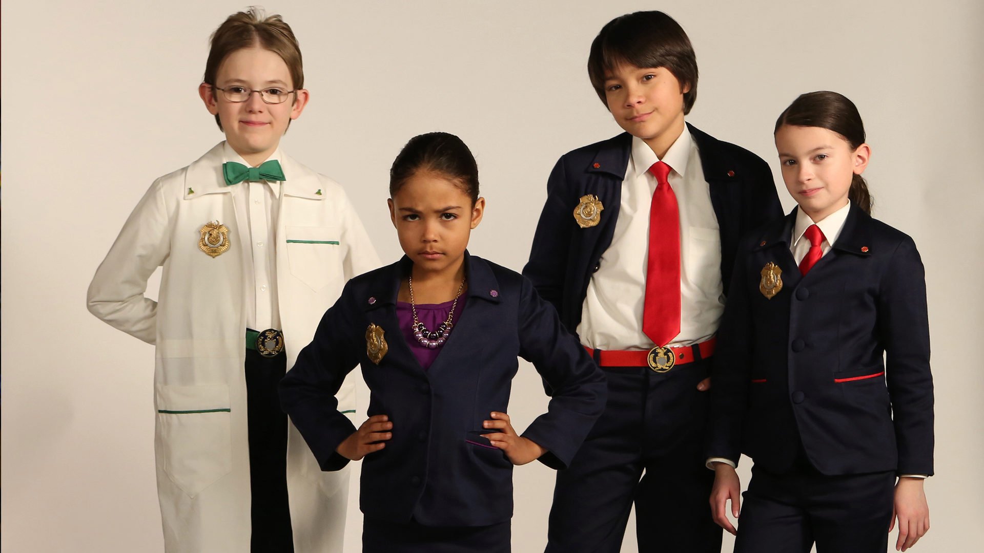 Photo of Odd Squad cast, from left to right, Oscar, Ms. O., Otto and Olive.