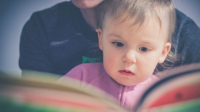 Baby reading a book