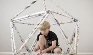 Rolled newspaper fort for kids