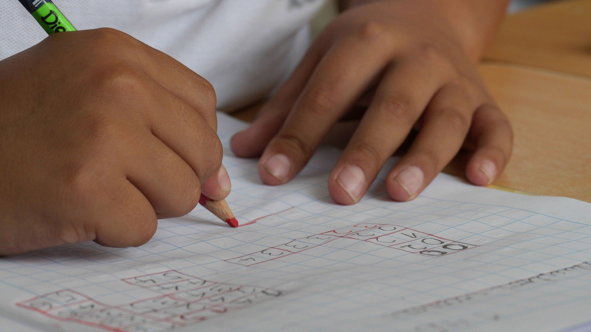 Child writing at school