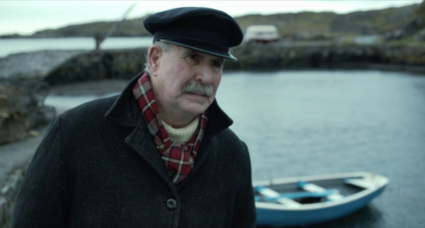 man looking concerned in front of boat