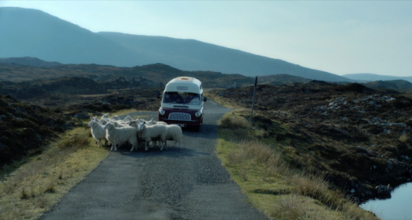 scottish mountains with van and sheep