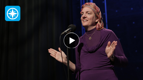 woman speaking on stage