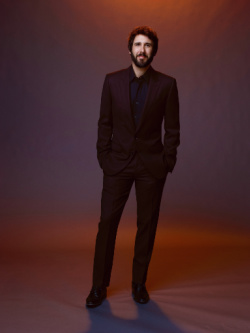 josh groban standing on a stage
