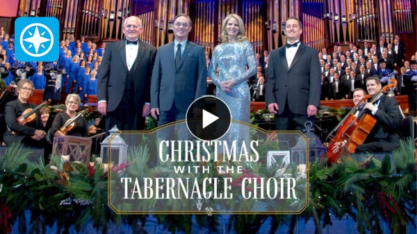 four people in front of a choir Text: Christmas with the Tabernacle Choir