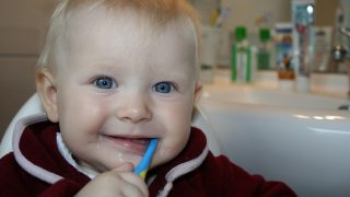 Baby brushing teeth