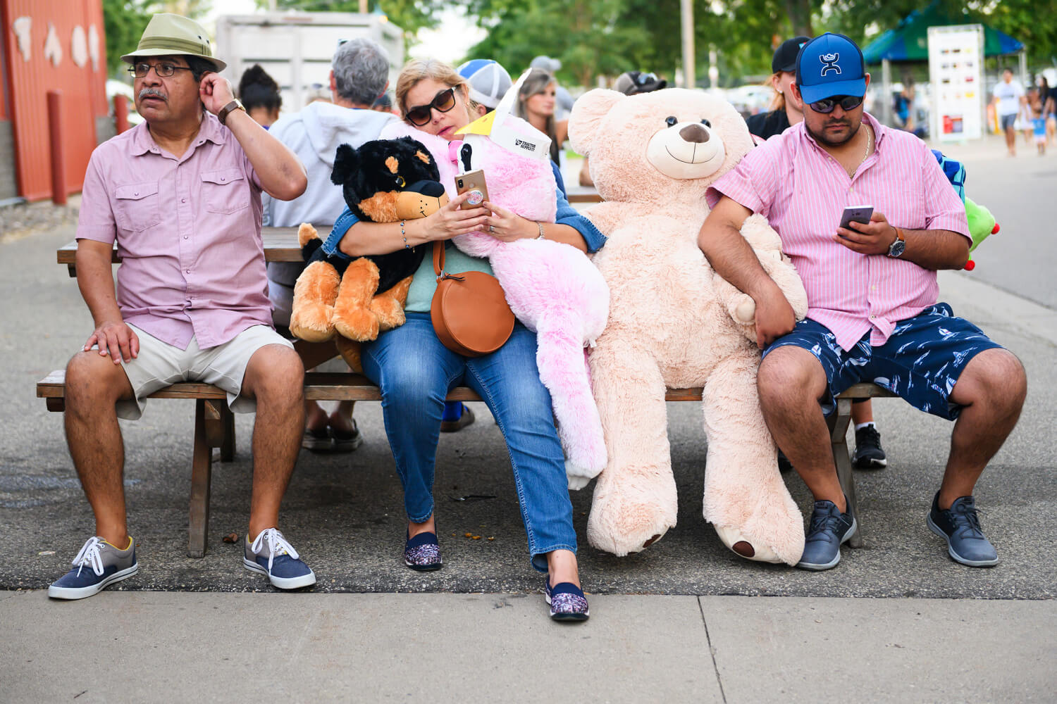 People at fair on a bench