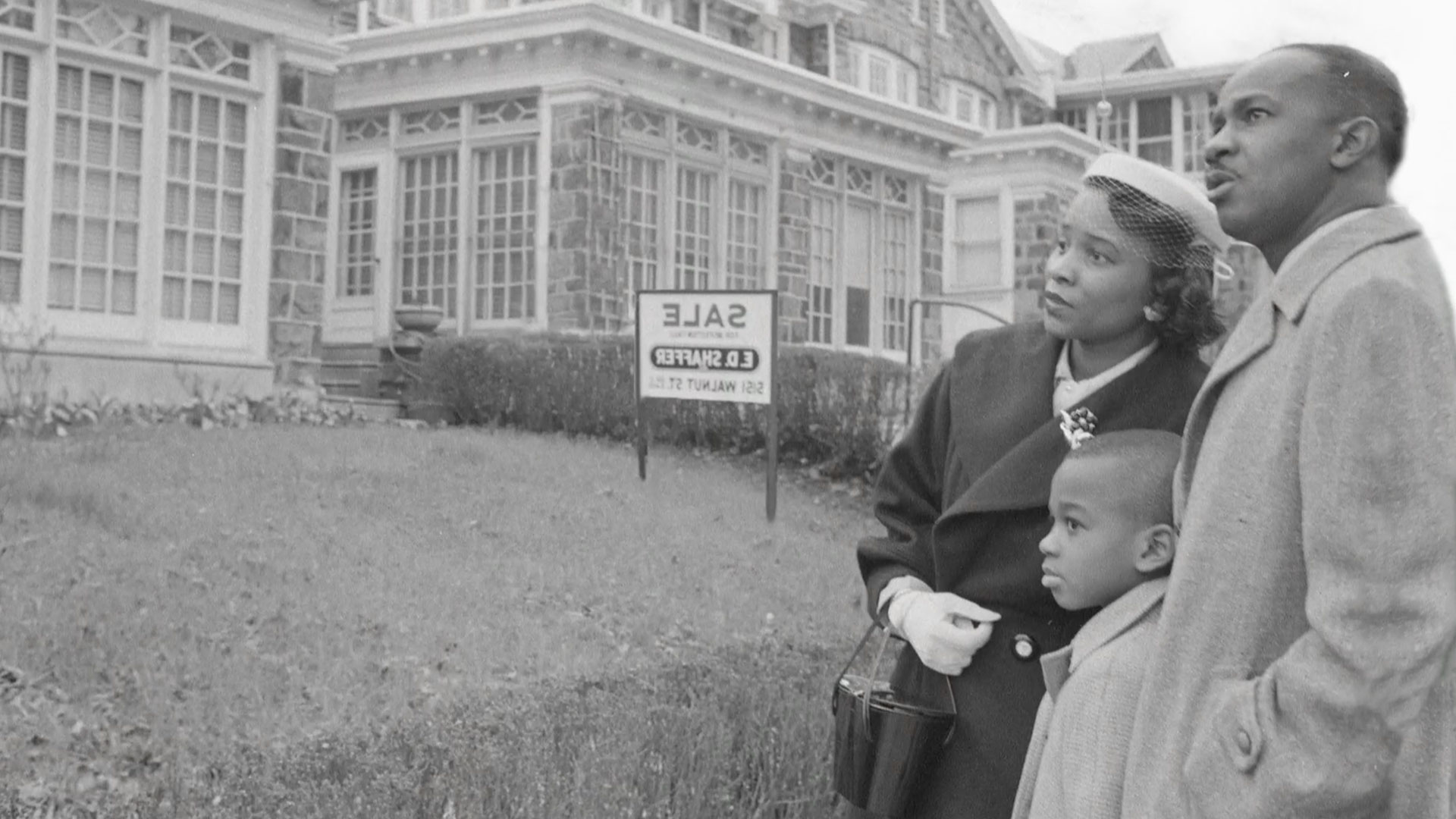 A family looks at houses